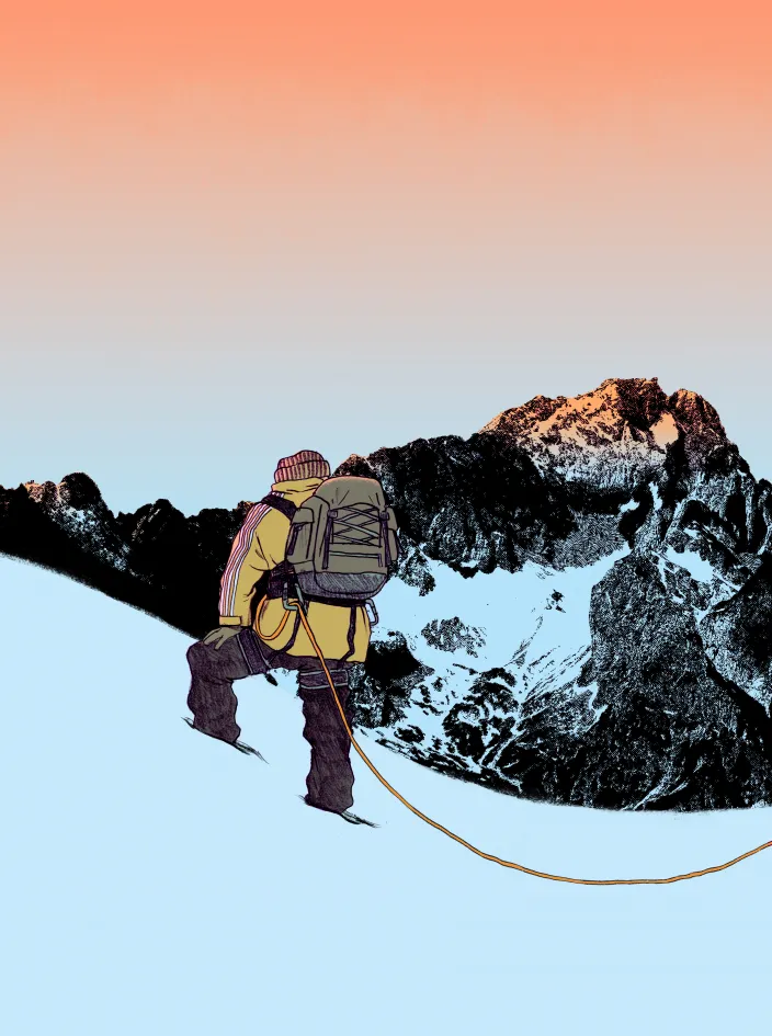 A mountaineer stands on a snowy slope at dawn and looks up at the Zugspitze.